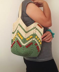 This handmade macrame crochet bag stands out with its unique bohemian style.  The beige and green colors, together with the intricate woven patterns, create an impressive and elegant look.  This carefully designed tote bag is the perfect size for everyday use, measuring 30 cm wide and 31 cm high. Its functional design helps you keep your belongings organized while ensuring durability for long-term use.  You can consider this bag as a thoughtful gift for your loved ones on special occasions.  Tha Spring Bohemian Beige Crochet Bag, Bohemian Bags With Granny Square In Natural Color, Beige Bohemian Crochet Bag With Braided Handles, Bohemian Natural Color Bags With Granny Square Detail, Spring Bohemian Crochet Bag, Bohemian Granny Square Natural Bag, Bohemian Granny Square Natural Color Bags, Bohemian Yarn Tote Bag, Casual Macrame Crochet Bag For Spring