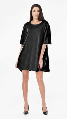 Get ready to shine in the ANNIE SEQUIN T-SHIRT DRESS! This versatile dress is perfect for any special occasion, with shimmering sequins that catch the light and add a touch of luxury to your wardrobe. You'll love the comfortable, glamorous, and effortless style of the ANNIE SEQUIN T-SHIRT DRESS! 🖤 this model who is a size S is photographed in a size L for extra movement. If you want that please size up 1-2 sizes. Choose your desired size for a shift-like fit (with room for movement) like how Da Glitter Short Sleeve Dresses For Parties, Short Sleeve Glitter Dress For Party, Glitter Short Sleeve Party Dress, Short Sleeve Glitter Party Dress, Metallic Glitter Mini Dress, Short Sleeve Glitter Dress For Party Season, Summer Metallic Dresses With Short Sleeves, Metallic Glitter Dress For Party Season, Metallic Glitter Dresses For Party Season