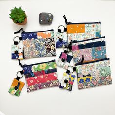 "Handmade Beautiful Patchwork Cotton Fabric Coin/Card Purse Pouch  with Little Mini Tiny Snap Wallet Keyring  Both sides of the purse have similar matching patchworks. Coin/Card Purse Size: 4.5\" X 3.5\" Little Snap Wallet Size: 1.75\" X 1.5\" Made by 100% cotton fabric All my products are handmade so the actual size may vary by about 0.1 inch.  For me, the pinnacle of my travel plans is the quest to discover a local fabric store. This mission is not limited to America alone; it extends to Asia Multicolor Zipper Coin Purse For Everyday, Multicolor Pouch Coin Purse For Everyday Use, Multicolor Zipper Coin Purse, Multicolor Pouch Wallet For Personal Use, Multicolor Pouch Wallet, Multicolor Wallets With Removable Pouch For Daily Use, Multicolor Rectangular Coin Purse, Multicolor Rectangular Coin Purse With Zipper, Multicolor Coin Purse With Removable Pouch For Daily Use