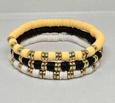 Set of 3 hand beaded bracelets with Gold accents. Can customize with wording of your choice. Wording will be white beads with gold letters. Heishi Jewelry, Heishi Bracelets, Clay Bracelets, Womens Gifts, Clay Bead Necklace, School Spirit Wear, Valentines Bracelets, Bracelets Beaded, Bead Projects