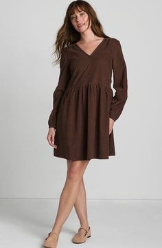 This dress is made from soft, lightweight corduroy, giving it a gentle texture that's super comfy. The effortless slip-on style and relaxed fit make it perfect for all-day wear, letting you move freely. The shirred waist adds a bit of shape without sacrificing comfort. It's a great addition to your wardrobe for its practical style. Soft pinwale corduroy Pull-over style V-neckline with finished trim Long sleeves finished with elastic at wrists On-seam pockets Gently shirred at the waist and shoul Long Sleeve Corduroy Dress For Fall, Corduroy Long Sleeve Dresses For Fall, Corduroy Dresses For Spring, Corduroy Dresses For Workwear, Casual Corduroy Dresses For Work, Brown Relaxed Fit Dress For Fall, Spring Corduroy Dress For Workwear, Long Sleeve Brown Corduroy Dress, Spring Casual Corduroy Dress