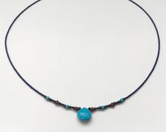 This is a very fine delicate semi precious necklace made with Turquoise teardrop stone, Lapis lazuli beads and touch of faceted 3mm Garnet, oxidised silver and Turquoise beads. Turquoise teardrop is 10x10mm size. Please take a look at all the photos and ask any questions you might have. The necklace is short but not quite a choker - it sits just under the collar bones. The full measurement from clasp to end is 44cm or 17.5 inches. All the jewellery comes in Heiter branded boxes. I ship all my items using recorded delivery with tracking number. Thank you! Turquoise Briolette Gemstone Bead Necklaces, Gift Beaded Teardrop Turquoise Necklace, Gift Turquoise Beaded Teardrop Necklace, Bohemian Necklace With Teardrop Pendant And Faceted Beads, Gift Teardrop Beaded Turquoise Necklace, Turquoise Teardrop Pendant Beaded Necklace For Gift, Bohemian Teardrop Pendant Necklace With Faceted Beads, Blue Beaded Teardrop Pendant Necklace For Gift, Adjustable Teardrop Turquoise Necklace With Natural Stones