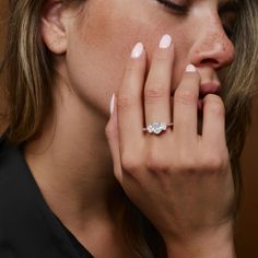 a close up of a person wearing a ring