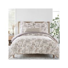 the comforter set is made up of floral print and has two pillows on each side