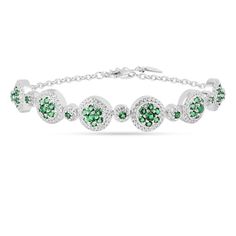 This bracelet features a combination of emerald green nanocrystal and created white sapphires, set in a halo design. The nano emeralds, ranging from 2.0mm to 1.9mm, add a green hue, while the created white sapphires, varying from 0.8mm to 1.1mm, provide contrast. This bracelet is crafted in rhodium over sterling silver, ensuring durability and brilliance. Green Diamond Round Bracelet, Round White Gold Bracelets With Emeralds, White Gold Emerald Bracelets, White Gold Emerald Bracelet, Round Green Diamond Emerald Bracelet, Green Round Cubic Zirconia Tennis Bracelet, Green Cubic Zirconia Round Tennis Bracelet, Green Cubic Zirconia Tennis Bracelet, Gold Gemstone Necklace