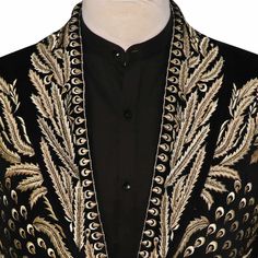 The Bespoke Black Blazer with Golden Hand-Embroidery is a masterpiece of elegance and opulence. Immerse yourself in the world of bespoke tailoring with this meticulously crafted garment.

 	Fabric: Velvet
 	Lining Fabric: Silk
 	Buttons: Brass
 	Pattern: Golden Hand Embroidery
 	Construction: Half Canvas
 	Jacket: Embroidery Shawl Lapel, Flap Pockets, Single Breasted Closure. Embroidered Silk Sherwani For Party, Elegant Embroidered Silk Sherwani, Party Silk Sherwani With Embroidery, Party Silk Embroidered Sherwani, Embroidered Silk Bandhgala For Party, Elegant Embroidered Bandhgala For Designer Wear, Formal Silk Bandhgala With Intricate Embroidery, Silk Bandhgala With Intricate Embroidery For Formal Occasions, Formal Fitted Silk Sherwani