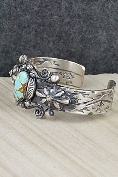 This beautifully intricate Royston turquoise and sterling silver bracelet was expertly crafted by Navajo silversmith Andrew Gordon. The inside is signed G and stamped sterling.Size: 5 1/2" (will fit up to a 6 1/2" wrist)Gap: 1"Width: 1 1/8"Free shipping on all orders! We ship with USPS and always include tracking. All orders ship within a day of payment.Returns are accepted up to 30 days after you receive your order. Just send us a message. Our shop offers cash back or store credit. The item mus Stamped Turquoise Bracelet, Turquoise Stamped Bracelet, Bohemian Silver Cuff Bracelet With Patina, Bohemian Engraved Turquoise Sterling Silver Bracelet, Silver Bohemian Cuff Bracelet With Patina, Southwestern Oxidized Adjustable Jewelry, Bohemian Turquoise Engraved Sterling Silver Bracelet, Unique Engraved Turquoise Bracelets, Southwestern Patina Bangle Jewelry