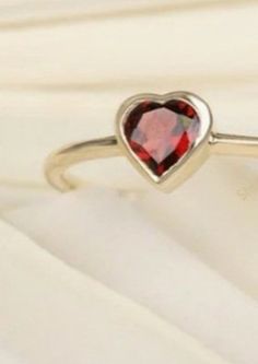 Happy merry Christmas day Natural Garnet Heart Ring | Anniversary ring Promises ring | Propose ring Engagement ring Women ring | handmade items Materials: Gold Gemstone: Garnet Gem color: Red Band color: gold This Beautiful Heart Shaped Solitaire Ring is a stylish way to celebrate your love. The center stone is vibrant Garnet stone, set in a classic Gold Plated Sterling Silver band. The Heart-Shaped Stone features an expert cut, shining brilliantly in this exquisite piece. Metal - Gold Plated Sterling Silver Metal Weight -2.10gm Main Stone - Garnet Main Stone Shape - Heart Main Stone Color - Red Main Stone Weight - 1.00ct Dainty Jewelry For Valentine's Day Proposal, Gold Birthstone Ring For Valentine's Day Proposal, Valentine's Day Gift Birthstone Open Ring, Valentine's Day Gift Open Birthstone Ring, Gold Ruby Ring For Valentine's Day Proposal, Dainty Heart-shaped Crystal Ring As Gift, Open Crystal Ring For Valentine's Day Promise, Gold Ruby Ring For Proposal On Valentine's Day, Valentine's Day Gift Birthstone Ring