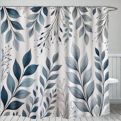 a shower curtain with blue leaves on it