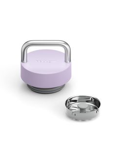 an image of a portable speaker with a ring on the side and a cup next to it