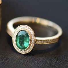 - Sophisticated Oval Engagement Ring Vintage - Superior Quality and Craftsmanship - Nature Inspired Green Ring - Vivid Green Natural Emerald - Ethically Sourced Gemstones - Conflict Free Diamonds - Made in the USA Have you ever seen something more beautiful than emerald ring in yellow gold surrounded by a sparkly diamo Elegant Rose Gold Emerald Ring In 14k, Luxury Emerald Rings With Halo Detail, Luxury Emerald Rings With Halo Design, Luxury Gold Emerald Round Ring, Luxury Gold Emerald Ring, Formal Emerald Rings Fine Jewelry, Formal Emerald Birthstone Ring, Classic Rose Gold Emerald Jewelry, Luxury Emerald Ring In Yellow Gold