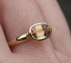 This is a one-off ring, a beautiful Imperial topaz set in 18ct recycled yellow gold. This particular stone has sold but we can get in some other options for you to choose from. An increasingly rare gem, most of the stock now just comes from Ouro Prêto in Brazil and very little is exported out of the country. It's colour ranges from yellow through to orange and the more expensive stones have flashes of pink. Like diving into honey.I can only get hold of a few of these, so options are limited but Modern Gold Topaz Birthstone Ring, Modern Gold Topaz Ring, Hallmarked, Timeless Gold Oval Topaz Ring, Timeless 14k Yellow Gold Topaz Ring, Timeless Oval Gold Topaz Ring, Timeless Yellow Gold Topaz Rings, 14k Yellow Gold Topaz Ring With Rose Cut Diamonds, Gold Topaz Ring With Bezel Setting In 14k Gold, Timeless Yellow Gold Topaz Ring Gift