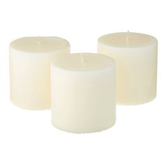 three white candles sitting next to each other