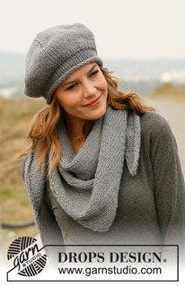 a woman wearing a gray hat and scarf