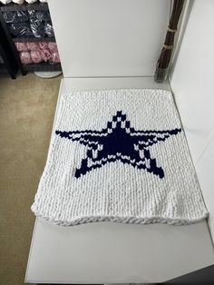 a knitted rug with an airplane on it