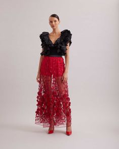 You'll be sure to light up the room in this romantic skirt style. The SANDY features a red sheer net, embroidered with a black elastic waist band and long tails that reach to your ankles. The waist is accented with red threads that create beautiful vines, leaves and 3D flowers that are embellished with red beads. Take your look to the next level by adding red heels, a dramatic top, or a glamorous clutch! Red Lace Skirt, Romantic Skirt, Net Skirt, Unique Skirts, Beaded Skirt, Sheer Maxi Dress, Princess Costume, Long Red, Red Outfit