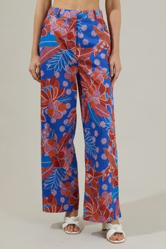 The Amazonia Blue Floral Mulvane Wide Leg Pants are here to show you keep you relaxed and in style! It shapes a high waist with a hidden zip fly and top button closure. It also has a stretchy waist on the back and pockets on each side. Pair this up with the matching top to complete the look!- Side pockets- High waist- Wide leg- Hook and clasp- Color: Blue RedSize + Fit - Model is 5'8" and wearing size XS- Measurements taken from size S - Waist: 14"- Inseam: 30 1/2" Fabric Self:100%Cotton Style N Versatile Blue Pants With Pockets, Versatile Blue Wide Leg Pants With Pockets, Blue Wide-leg Jeans, Blue Straight-leg Bottoms For Spring, Versatile Blue Wide Leg Pants For Summer, Versatile Straight Leg Blue Bottoms, Versatile Blue Jeans For Workwear, Versatile Blue Cotton Bottoms, Versatile Blue Cotton Pants