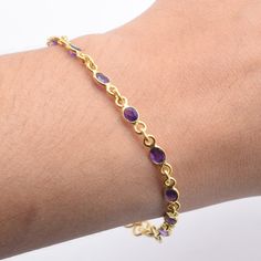 Solid Gold 9k/14k/18k Natural Cut Purple Amethyst Gemstone Adjustable Handmade Gold Bracelet ~ February Month Birthstone ~Gift For Christmas **BRACELET DETAILS** Stone Size - 3x5 MM No of Stone in 19 cm Bracelet - 13 pcs (Please message for customisation) Length- 19 Centimeter Weight- 4.2 gm The Bracelet stamped 9k/14k/18k . We guarantee the quality and the genuine properties of silver and the stone.  About Purple Amethyst :-  Amethyst has healing powers to help with physical ailments, emotional issues, and in Energy Healing and Chakra balancing. Amethyst crystal therapies are primarily associated with physical ailments of the nervous system, the curing of nightmares and insomnia, and balancing the crown chakra. Delivery-  Delivery ( IMPORTANT PLEASE READ)  Our Aim is to dispatch the parce Gold And Purple Bracelet, Yellow Gold Plated Bracelet With Gemstone, Gold Plated Purple Jewelry For Gifts, Purple Gold Plated Jewelry For Gifts, Elegant Amethyst Bracelet, Purple Gold Plated Jewelry Gift, Purple Gold-plated Jewelry Gift, Purple Round Bracelets For Anniversary, Purple Round Fine Jewelry Bracelets