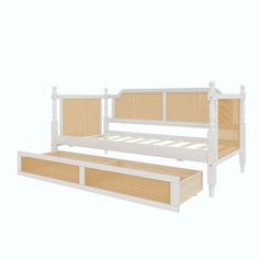 the bed frame is made with wicker and has two drawers on each side for storage