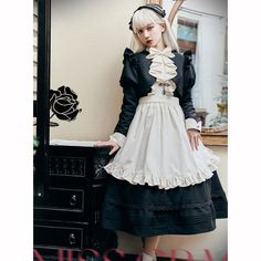 An embroidered dress, short jacket, and strap apron that will make you look like a butler's daughter with a mysterious atmosphere. The front of the dress is decorated with cross-shaped embroidery, and the jacket has bulges around the shoulders and is decorated with ruffles. An elegant item with a high waist and wide hem. 
 
 
 
 Scheduled delivery 
 
 This is a pre-order item. 
 It will take about 2 to 3 months from order to delivery. 
 
 
 Item 
 
 3-piece set of dress + short jacket (with jabo Vintage Cosplay Dresses For Spring, Vintage Spring Dresses For Cosplay, Vintage Dresses For Spring Cosplay, Cotton Victorian Dress For Dressmaking, Long Sleeve Cotton Dress For Cosplay, Gothic Doll Collar Costume Dress, Gothic Cotton Dress With Ruffles, Gothic Doll Collar Dress For Costumes, Long Sleeve Cotton Dress For Costume Party