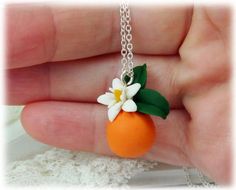 Petite elegant detailed handcrafted Orange Blossom Necklace. The orange necklace drops from assorted chain and matching bail to choose from. -Original hand sculpted polymer clay flowers -Durable, water-resistant -No molds, no paint, no glue -Pendant Length : 1 inch -16 inch or 18 inch chain -Chain and Bail : Choose Silver-plated, Gold-plated, Antique Brass, 925 sterling Silver or 14k Gold Filled Matching earrings sold separately and available at: https://www.etsy.com/listing/611479025 Flowers ar Orange Blossom Jewelry, Orange Flower Pendant Necklace Gift, Orange Flower Pendant Necklace For Gift, Handmade Orange Flower Pendant Necklace, Handmade Orange Necklace With Flower Pendant, Orange Flower Pendant Jewelry Gift, Orange Flower Pendant Jewelry For Gift, Orange Jewelry With Lobster Clasp For Gift, Nickel-free Orange Necklace For Gift