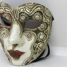 PLEASE WRITE YOUR TELEPHONE NUMBER WHEN YOU COMPLETE YOUR ORDER: Traditional and original papier-mache Venetian mask, handmade and decorated with acrylics colors. All our masks are handmade in our stores located in Venice. Our decorators use techniques typical of the Venetian tradition such as stucco, acrylics, gold and silver-leaf, macramè, passemenerie, pearls and crequelè to give you a wide range of masks. This shape is available in many different designs, colors and techniques. This mask is Venetian Half Mask, Paper Mache Clown Mask, Hand Painted White Mask, Artistic White Masks For Mardi Gras, Hand-painted White Masks For Masquerade, Hand Painted White Mask For Masquerade, Hand Painted White Masks For Masquerade, Artistic White Masks And Prosthetics For Mardi Gras, Artistic White Eye Mask For Masquerade