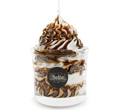 an ice cream sundae with caramel swirl and whipped cream in a glass container