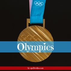 a gold medal with the olympic logo on it's back and blue ribbon around its neck