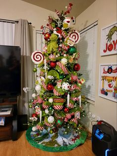 a christmas tree decorated with candy canes and candies