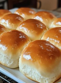 rolls sitting on top of a white plate