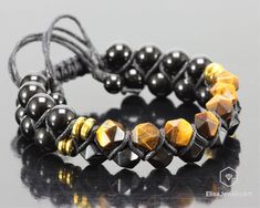 "Men's Bracelet Natural Tiger Eye Black Onyx Macrame Double Row Adjustable Bracelet Macrame Gift For Him Gift For Fathers Gift for Husband -ALL THE PRODUCTS AT ELISAJEWELRYART ARE HANDMADE AND MADE WITH NATURAL BEADS. -WHAT DOES THE TIGER EYE STAND FOR Tigers Eye Stone is a crystal with lovely bands of yellow-golden color through it. This is a powerful stone that helps you to release fear and anxiety and aids harmony and balance. It stimulates taking action, and helps you to make decisions with Black Bohemian Braided Bracelets Hand Wrapped, Black Adjustable Braided Bracelets With Round Beads, Black Bohemian Bracelets With Adjustable Cord, Black Hand Wrapped Spiritual Friendship Bracelets, Black Resizable Bracelets With Round Beads, Black Bohemian Bracelet With Adjustable Cord, Adjustable Black Braided Bracelet With Round Beads, Black Bohemian Braided Bracelet With Round Beads, Black Spiritual Bracelet With Adjustable Cord