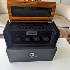 This Is A Boda Concept Walnut And Piano Black Watch Winder With 4 Individual Programmable Automatic Watch Winders And Space For 6 Additional Watches. Each Winder Can Hold A Watch 66mm In Diameter And Can Be Programmed To Rotate Clockwise, Counterclockwise Or Combination Of Both. Japanese Winding Motors Rotate At Programmable Speed Between 600-2100. Digital Display And Led Backlighting. Automatic Watch Winder, Watch Winders, Watch Winder, Digital Display, Black Watch, Automatic Watch, Piano, Walnut, Led