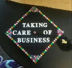 a graduation cap that says taking care of business