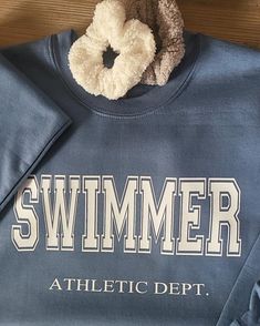 Varsity Letter Swimmer Sweatshirt. Cozy time with this beautiful soft sweatshirt, layer it up or simply wear it with shorts and sweats. Sport your sweatshirt on meet day, coffee run or as your fav streetwear. Navy blue, Gray, Indigo blue, Mustard yellow Unisex sizing 50% cotton, 50% polyester Summer Crew Neck Athleisure Sweatshirt, Summer Athleisure Sweatshirt With Crew Neck, Summer Athleisure Crew Neck Sweatshirt, Sporty Summer Sweatshirt For Leisure, Sporty Summer Leisure Sweatshirt, Sporty Letter Print Sweatshirt For Summer, Comfy Leisure Sweatshirt With Letter Print, Swimming Coach, Emily Fields