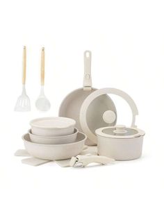 an assortment of kitchen items including pots and pans, utensils and spatulas