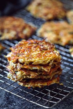 some food is sitting on top of a wire rack and ready to be grilled