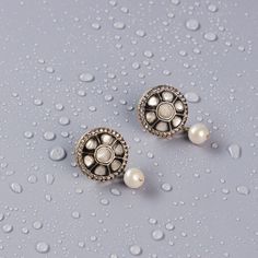 Crafted in silver, these earrings are not only stunning but also durable. They are perfect for anyone who loves jewelry that is both timeless and elegant. These stunning earrings feature semi-precious polkis surrounded by CZ stones, with a beautiful vintage victorian finish that adds an extra layer of elegance to the overall look. These studs have gorgeous semi-precious pearls drops makes the stud super chic. Elegant Silver Jeweled Danglers, Silver Pearl Earrings With Stone Work For Gift, Ornate Silver Earrings With Stone Work, Silver Jeweled Earrings For Festive Occasions, Silver Jeweled Earrings For Festive Season, Silver Jeweled Bridal Earrings For Festive Occasions, Silver Jeweled Chandbali Earrings, Festive Jeweled Silver Earrings, Festive Silver Jeweled Bridal Earrings