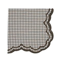 a brown and white checkered napkin with scalloped edges