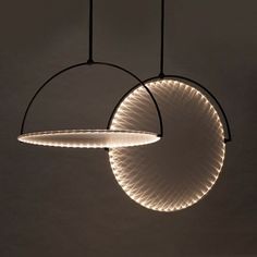 three circular lights hanging from the ceiling