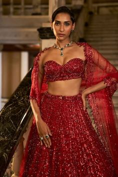 Red lehenga featuring crystal, sequin, and bead embroidery in a linear pattern. Paired with a sweetheart neck padded blouse and a border embroidered dupatta., Fit: Relaxed Crystal Lehenga, Linear Embroidery, Mera Bharat Mahan, Bridal Lehenga Blouse, Embroidered Bridal Lehenga, Seema Gujral, Net Embroidery, Crystal Embroidery, Padded Blouse