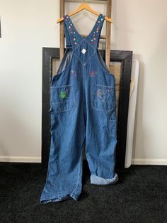 Well.. I do believe these overalls sell itself! The cross-stitch frog is my favorite🐸 They are in Excellent condition with a couple of threads broken in the stitching where the Big Mac patch is in back. I would be more than happy to send extra pictures upon request. The buckle works great and straps are adjustable. I have gently washed these in mild detergent and are now ready for their next fun owner!! All measurements are taken with the garment laying flat, double for the bust, waist and hips Embroidered Overalls, Overalls Vintage, Vintage Overalls, Big Mac, Union Made, 1970s, Overalls, Comfort Fit, Cross Stitch