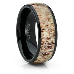 a black ceramic ring with an antelope inlay