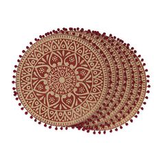 three red and gold round placemats with pom - poms