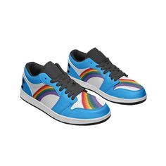 a pair of sneakers with rainbows on them