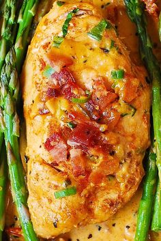 chicken breast with asparagus and gravy in a white sauce