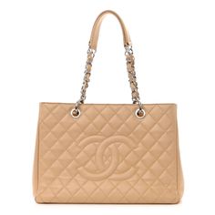 This is an authentic CHANEL Caviar Quilted Grand Shopping Tote GST in Beige. This tote is beautifully crafted of luxurious diamond-quilted caviar leather in beige. The bag features silver chain link leather-threaded shoulder straps with leather shoulder pads, a stitched Chanel CC logo on the front, and a rear patch pocket. The top is open to a partitioned beige fabric interior with zipper and patch pockets. Chanel Grand Shopping Tote, Chanel Tote Bag, Chanel Tote, Chanel Shoulder Bag, Chanel Caviar, Beige Fabric, Shopping Tote Bag, Cc Logo, Shopping Tote