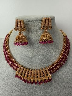 This exquisite piece of craftsmanship comes from our Traditional collection. Finish: 24 grams gold finish Necklace Fastening: Adjustable Dori  Perfect for Indian weddings. Earring jhumka Fastening: Push Back Contains: 1 necklace, 1 pair of earrings Gold Plated Latkans Necklaces For Festivals, Gold Plated Necklaces With Latkans For Festivals, Festival Gold-plated Necklaces With Latkans, Gold Chandbali Necklace With Latkans, Traditional Plated Jewelry Gift, Gold Plated Gold Necklaces With Latkans, Gold Temple Jewelry Necklaces With Latkans, Ceremonial Gold Plated Necklaces With Latkans, Gold Plated Tilla Necklace For Gift