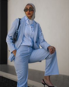 The trousers of this elegant suit stay wide all the way to the bottom. Whether it's a wedding, special occasion or even at any business-casual event, this sky blue wide leg suit is a great option. Cut and tailored from Technical fabric specifically with women in mind, this elegant relaxed fit sky blue suit makes you look trendy and classy. Polyester-Rayon keeps the medium rise waistline smooth and the wide legs crisp on these retro-inspired everyday trousers.  At sumissura every single suit is m Spring Office Wear Suits With Pressed Crease, Chic Light Blue Blazer For Formal Occasions, Light Blue Notch Lapel Suits For Work, Blue Double-breasted Notch Lapel Suit For Work, Elegant Light Blue Blazer For Workwear, Spring Business Pantsuit With Wide-leg Pants, Spring Business Wide-leg Pantsuit, Elegant Light Blue Blazer For Work, Light Blue Notch Lapel Suit For Office