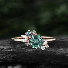 "This is a Lab green sapphire engagement ring in solid gold,about 6x6mm Hexagon. The accent stones are moissanites and alexandrites. The band width is about 1.4mm. It can be made in any ring size. However please contact me to custom make it to a special big or small size. It can be made in white gold,rose gold or yellow gold with 14k or 18k. However for some people who are nickel allergic,I can also make it to 925 sterling silver to make you can wear it. The ring is handmade,very high quality! 3 Cluster Sapphire Engagement Ring, Emerald Cut Sapphire Jewelry With Rose Cut Diamonds, Quince Rings, Dark Green Ring, Green Engagement Ring, Green Moissanite Engagement Ring, Green Moissanite Ring, Green Engagement Rings, Teal Sapphire Engagement Ring