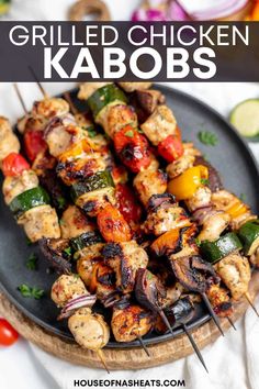 grilled chicken kabobs on a black plate with text overlay that reads grilled chicken kabobs